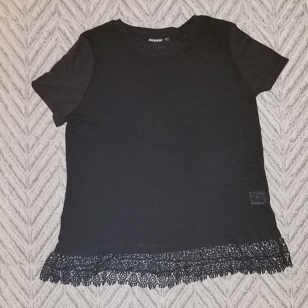 Black short sleeved shirt w/ fringe at the bottom